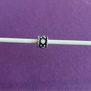 Pandora Retired Sterling Silver Oxy Crown charm with clear CZ stones.